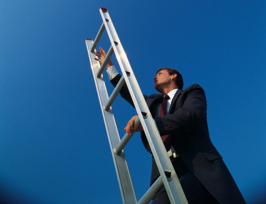 businessman climbing the corporate ladder