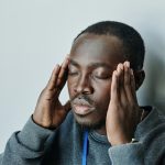 Man holding head