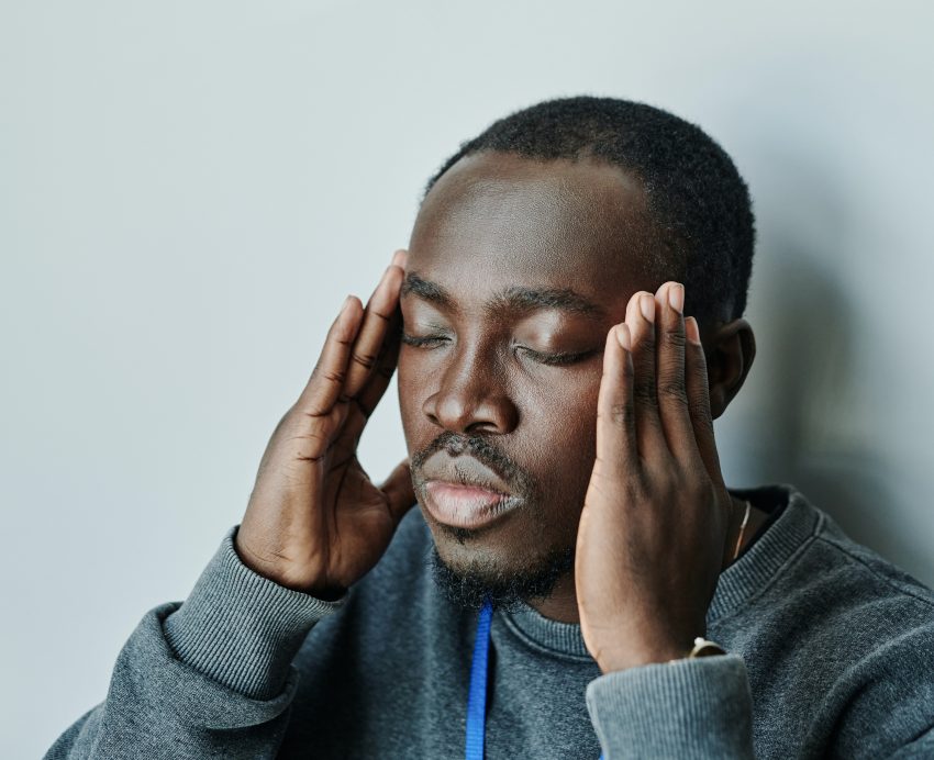 Man holding head